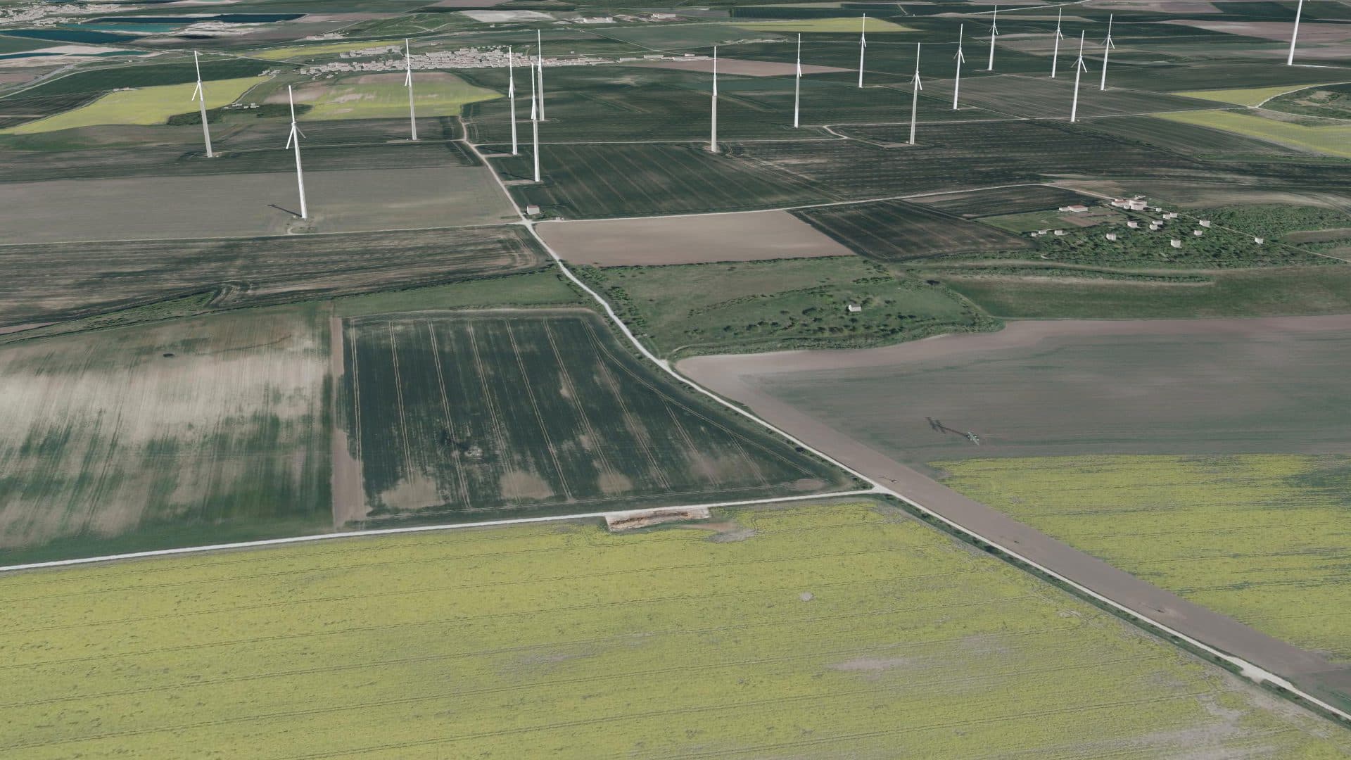 Windpark in 3D über Feldern: Türme und Rotoren der Windräder in der Landschaft, aus geringer Höhe gesehen.